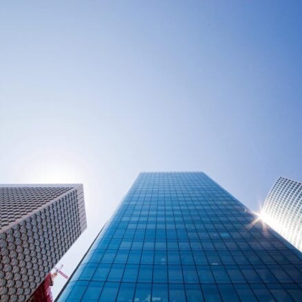 Business skyscrapers, sunny blue sky. La Defense financial district in Paris, France.