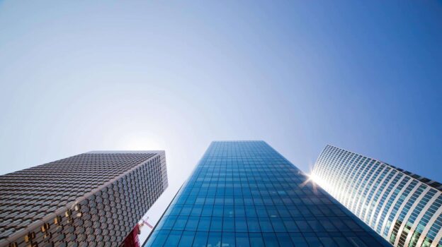 Business skyscrapers. La Defense, Paris, France Business skyscrapers, sunny blue sky. La Defense financial district in Paris, France.